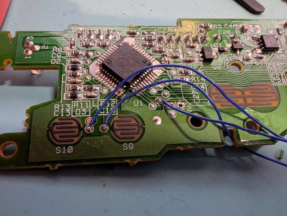 Main PCB with wires on the test pads for the buttons.