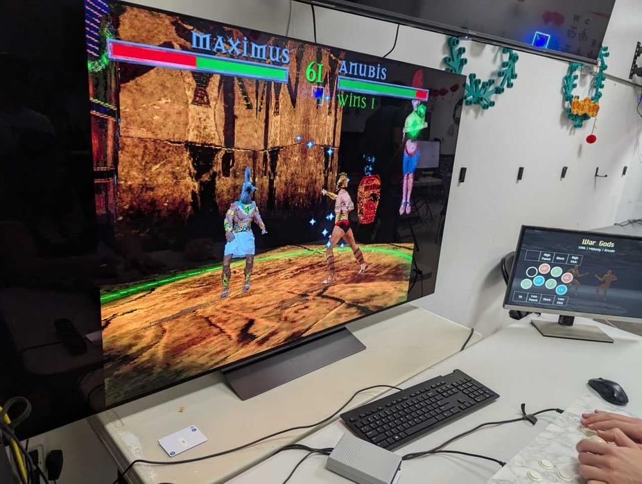 War Gods in play, with instructions on a smaller monitor.