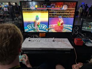Punch-Out, for Wii. The players are using the traditional pads, and the arcade buttons are unlit to indicate it is not used for this game.