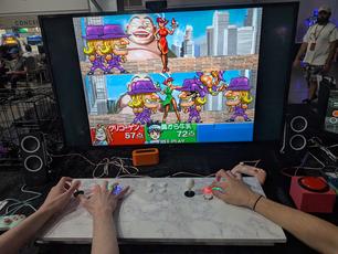 Great Bishi Bashi Champ, an arcade game. Note the differently-colored buttons, as it does not use the joysticks.
